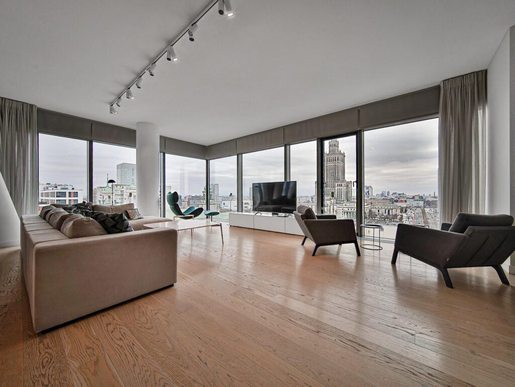 Spacious living room with Palace of Culture view luxury apartments Warsaw for expats